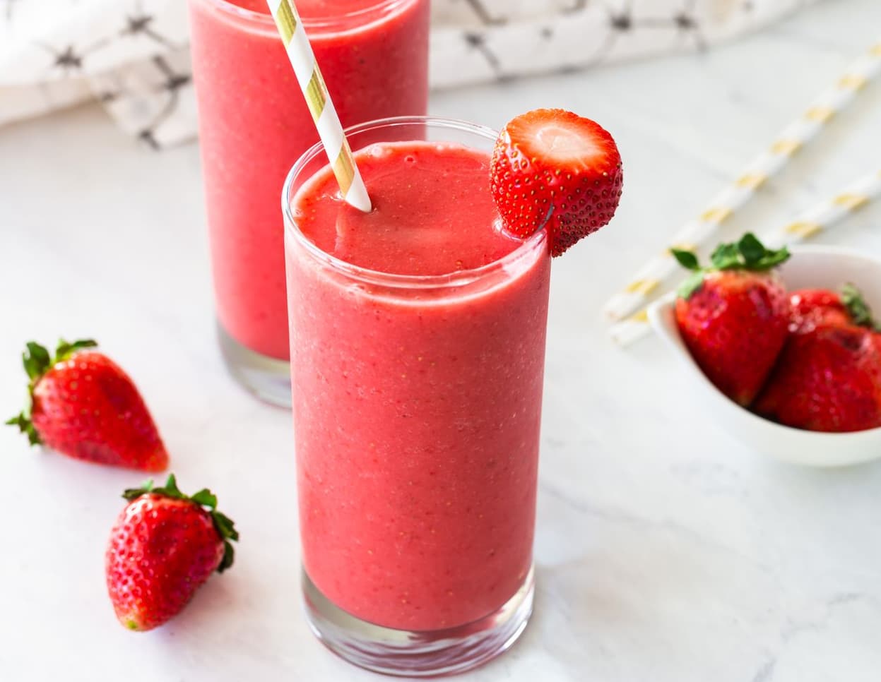 A refreshing assortment of colorful fruit smoothies, showcasing their vibrant colors and healthy ingredients.